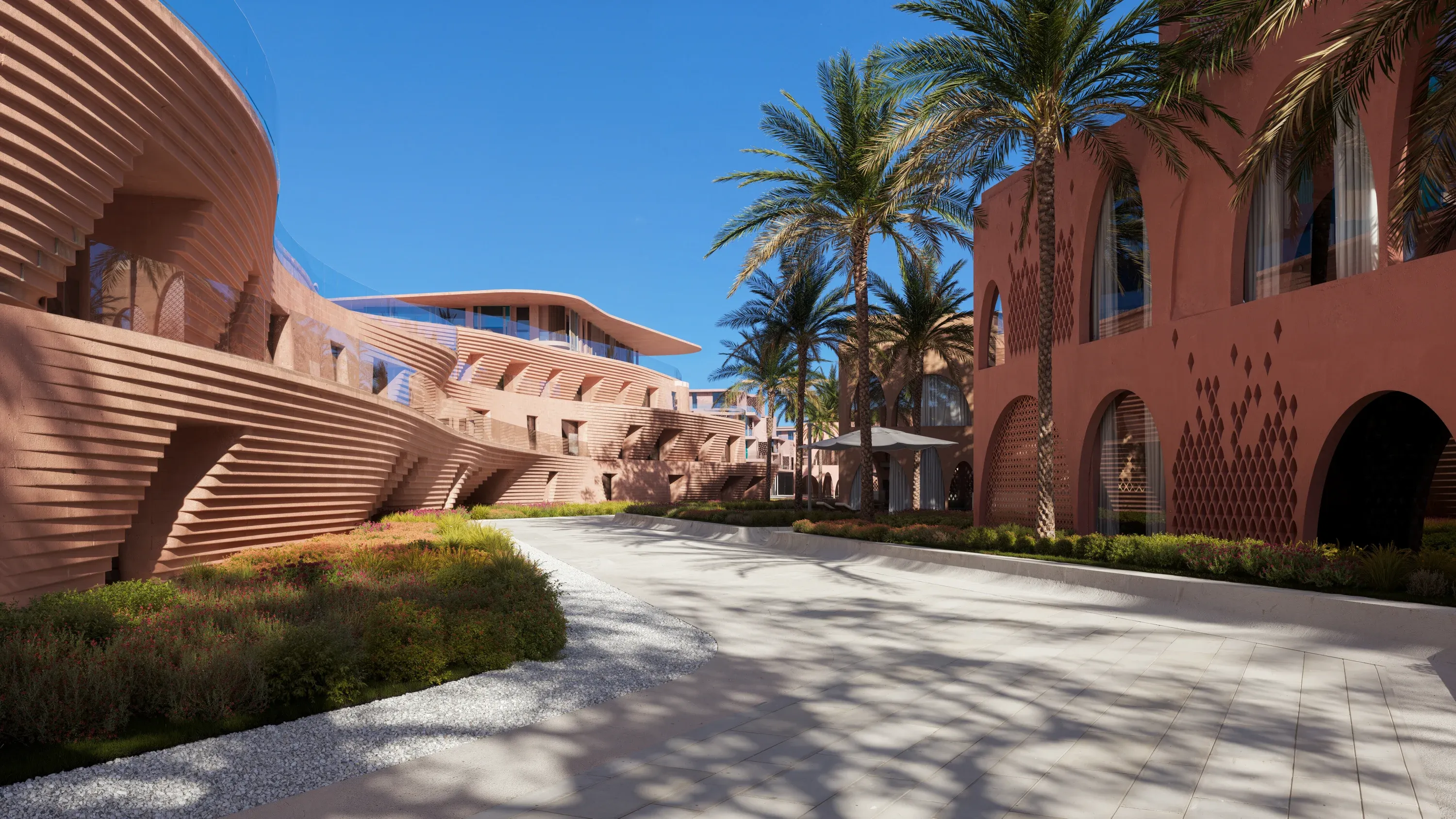 The palm-lined arrival court of the resort hotel at Mira Coral Bay